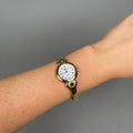 Case Gold Plated Stainless Steel Dial White Dial Black Roman Half Bangle